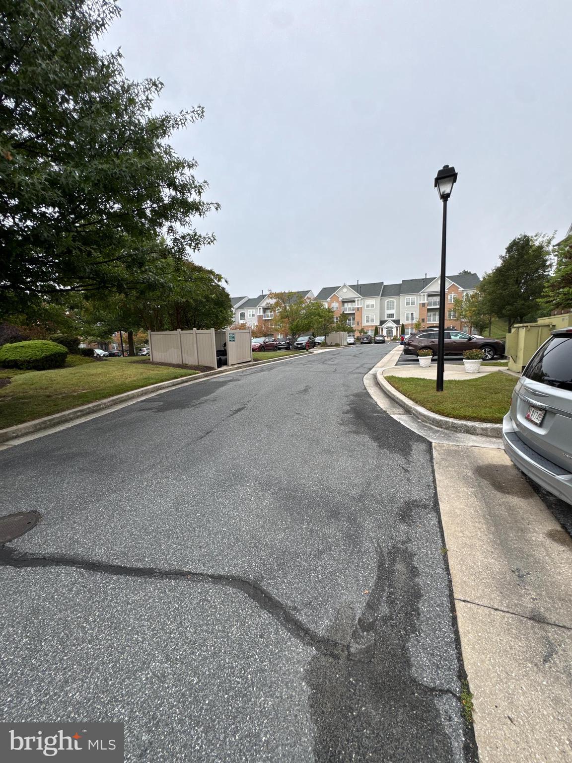 5144 Brightleaf Court, Unit 5144 Rosedale, MD 21237 - Photo 37 of 47 a view of a street with some cars parked on the road
