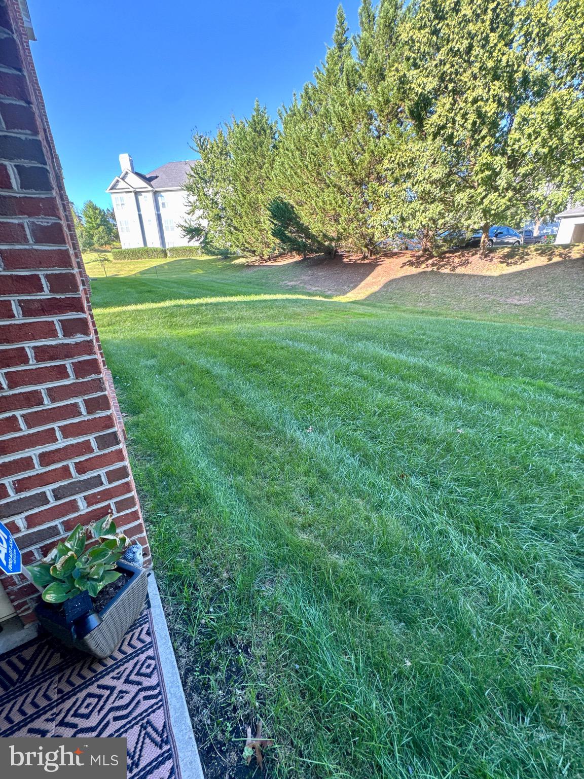 5144 Brightleaf Court, Unit 5144 Rosedale, MD 21237 - Photo 44 of 47 a view of a garden with a bench
