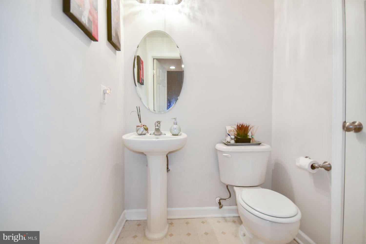 1240 Steed Street Ranson, WV 25438 - Photo 22 of 30 a bathroom with a toilet sink and mirror