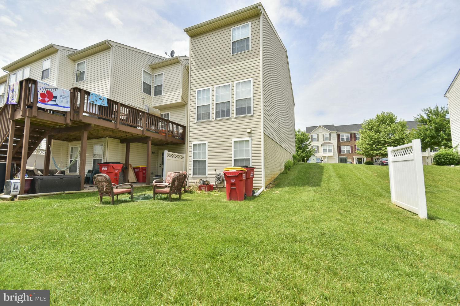 1240 Steed Street Ranson, WV 25438 - Photo 26 of 30 a view of a house with a yard and sitting area