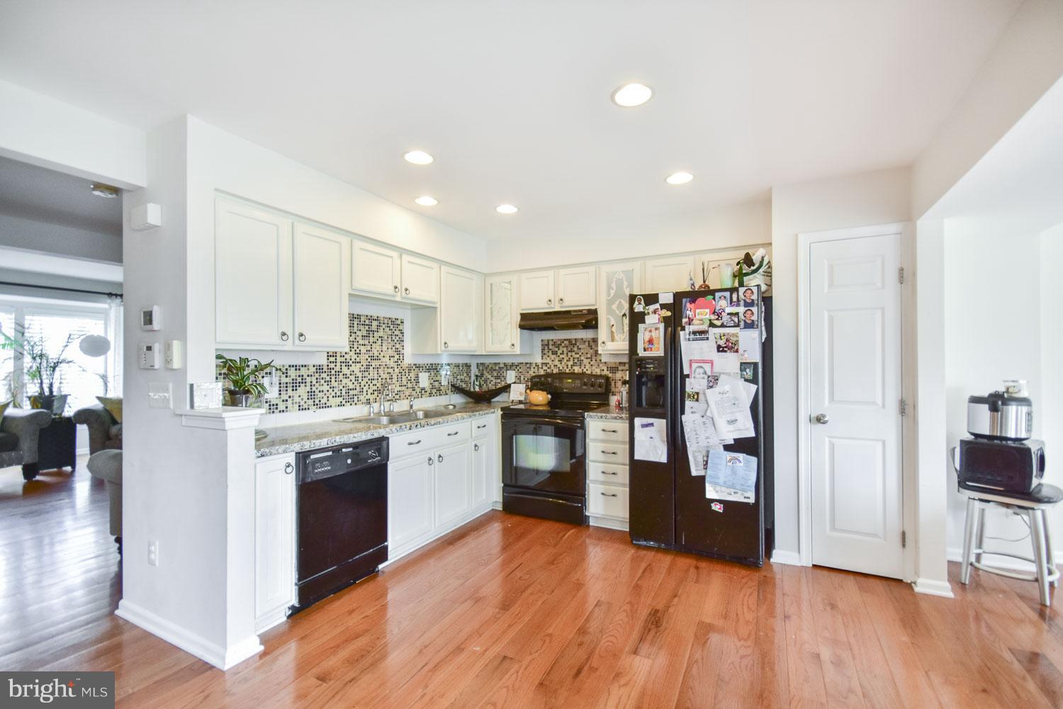 1240 Steed Street Ranson, WV 25438 - Photo 6 of 30 a kitchen with stainless steel appliances granite countertop a refrigerator and stove top oven