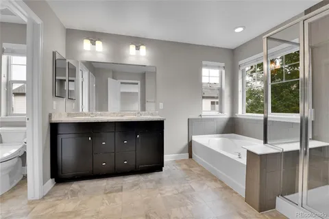a living room with a large bed and a dresser