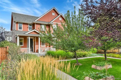 a front view of a house with a yard table and chairs