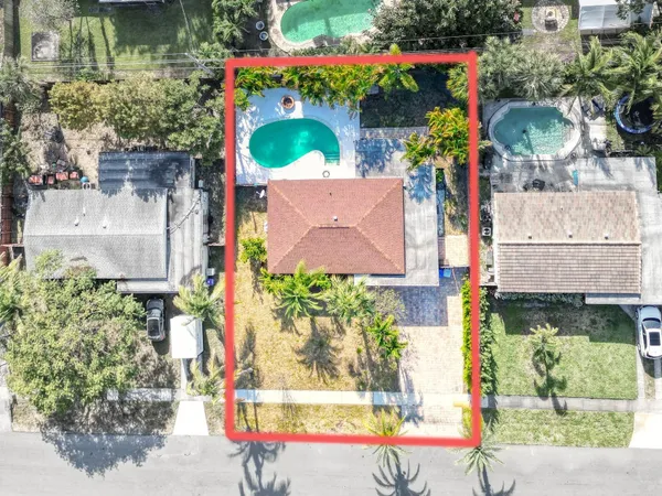 an aerial view of a house with swimming pool