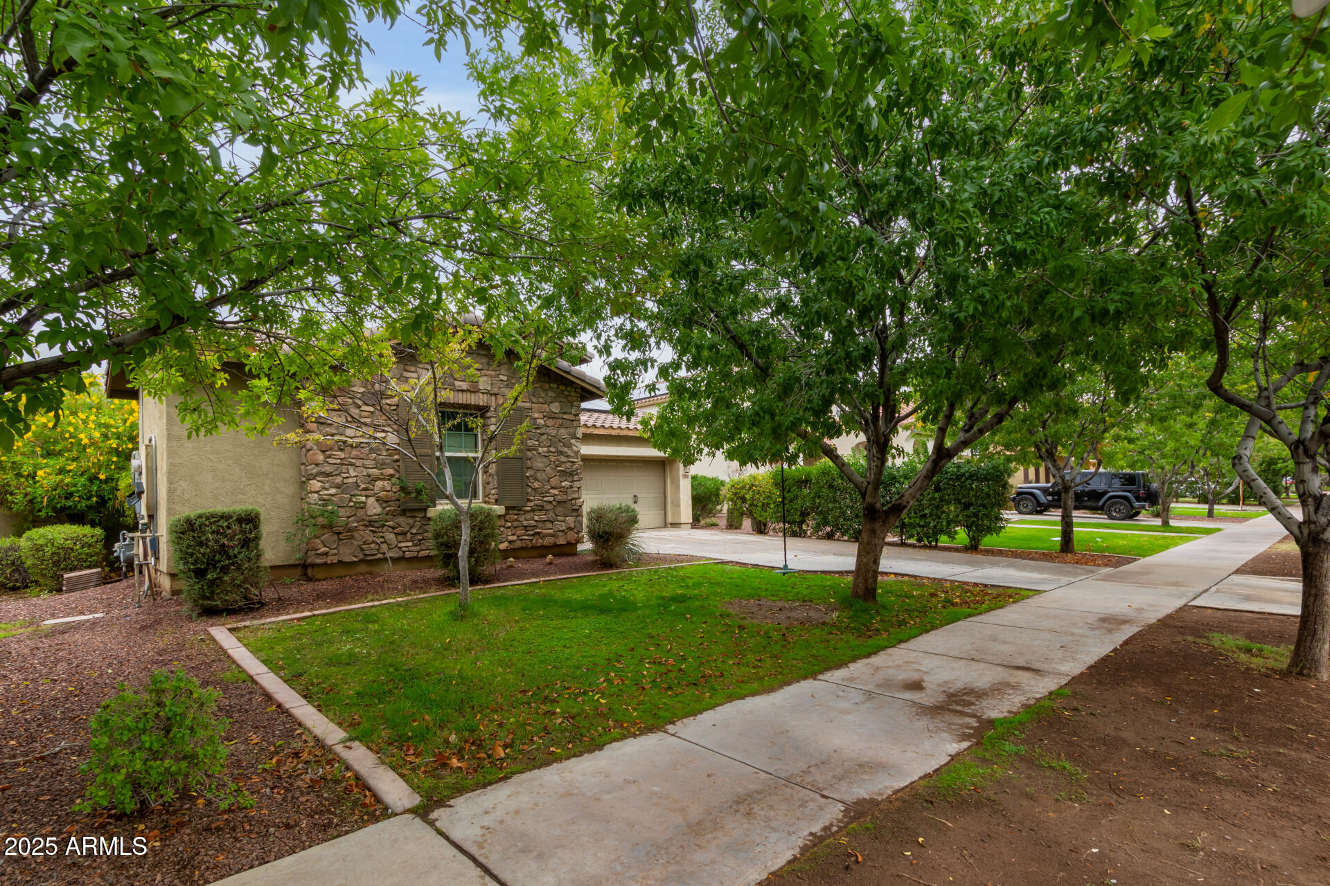20768 West Hamilton Street Buckeye, AZ 85396 - Photo 2 of 33 a front view of a house with a yard