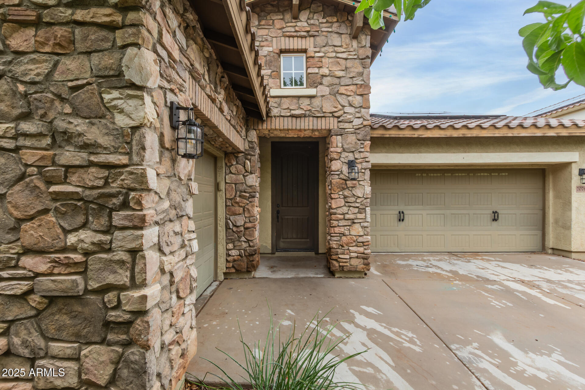 20768 West Hamilton Street Buckeye, AZ 85396 - Photo 5 of 33 a front view of a house with a garage