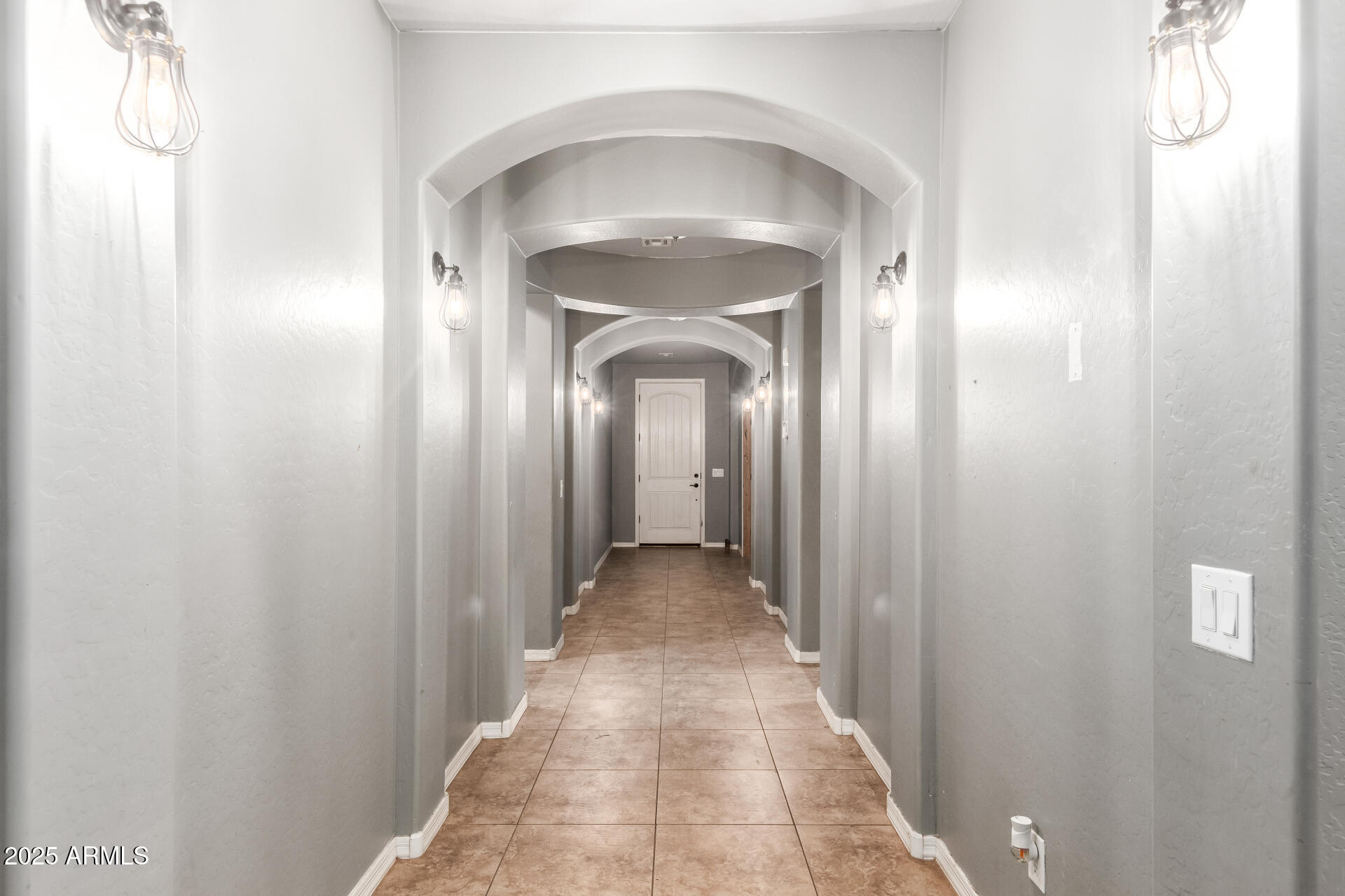 20768 West Hamilton Street Buckeye, AZ 85396 - Photo 6 of 33 a view of a hallway with a wooden door