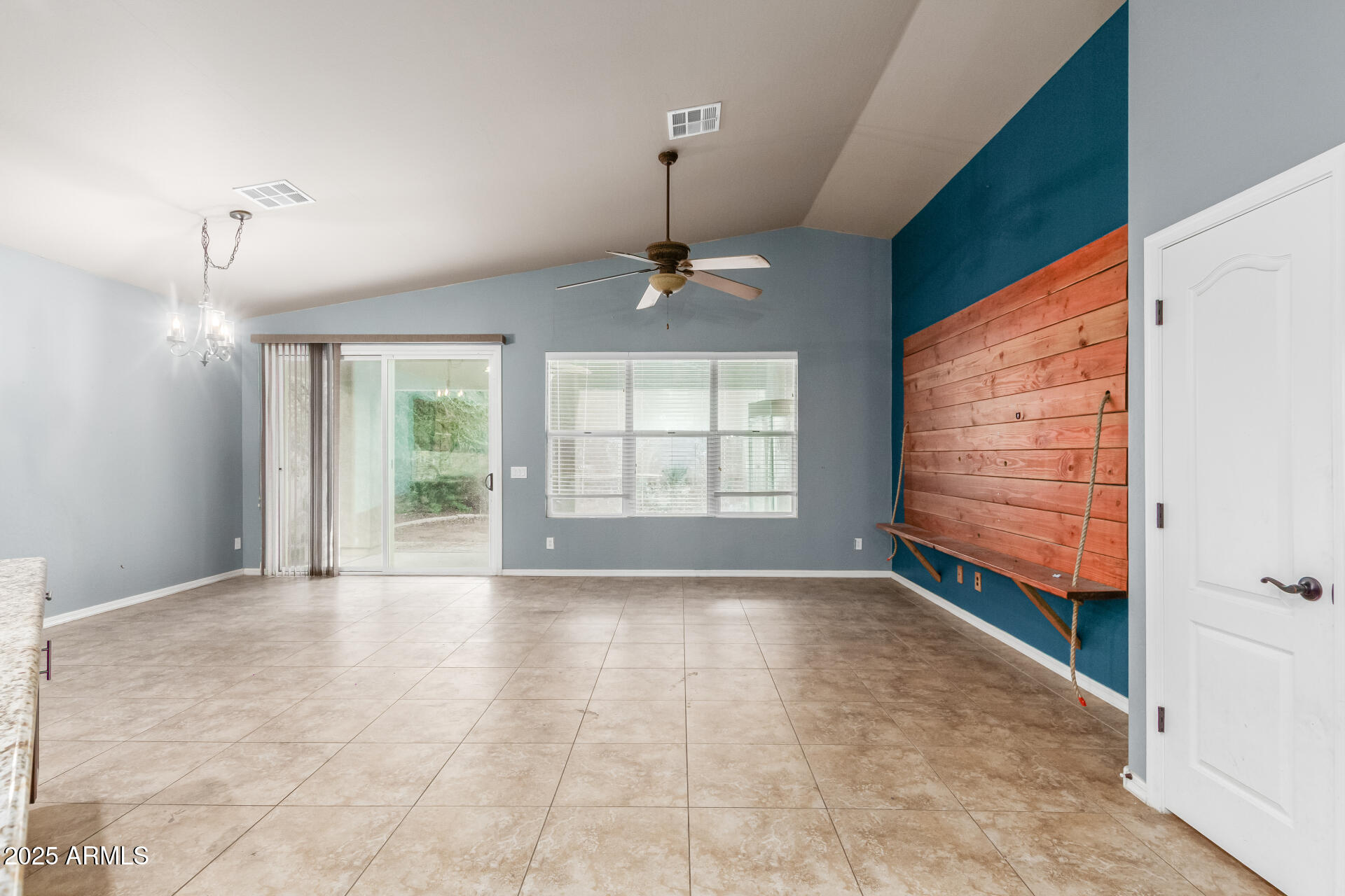 20768 West Hamilton Street Buckeye, AZ 85396 - Photo 7 of 33 a view of an empty room with a window