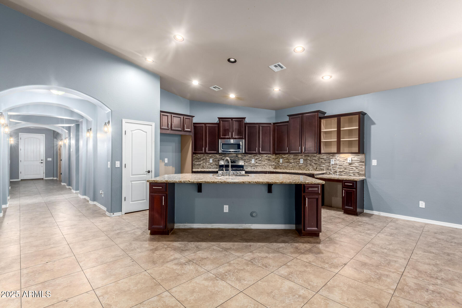 20768 West Hamilton Street Buckeye, AZ 85396 - Photo 9 of 33 a view of kitchen with center island and stainless steel appliances