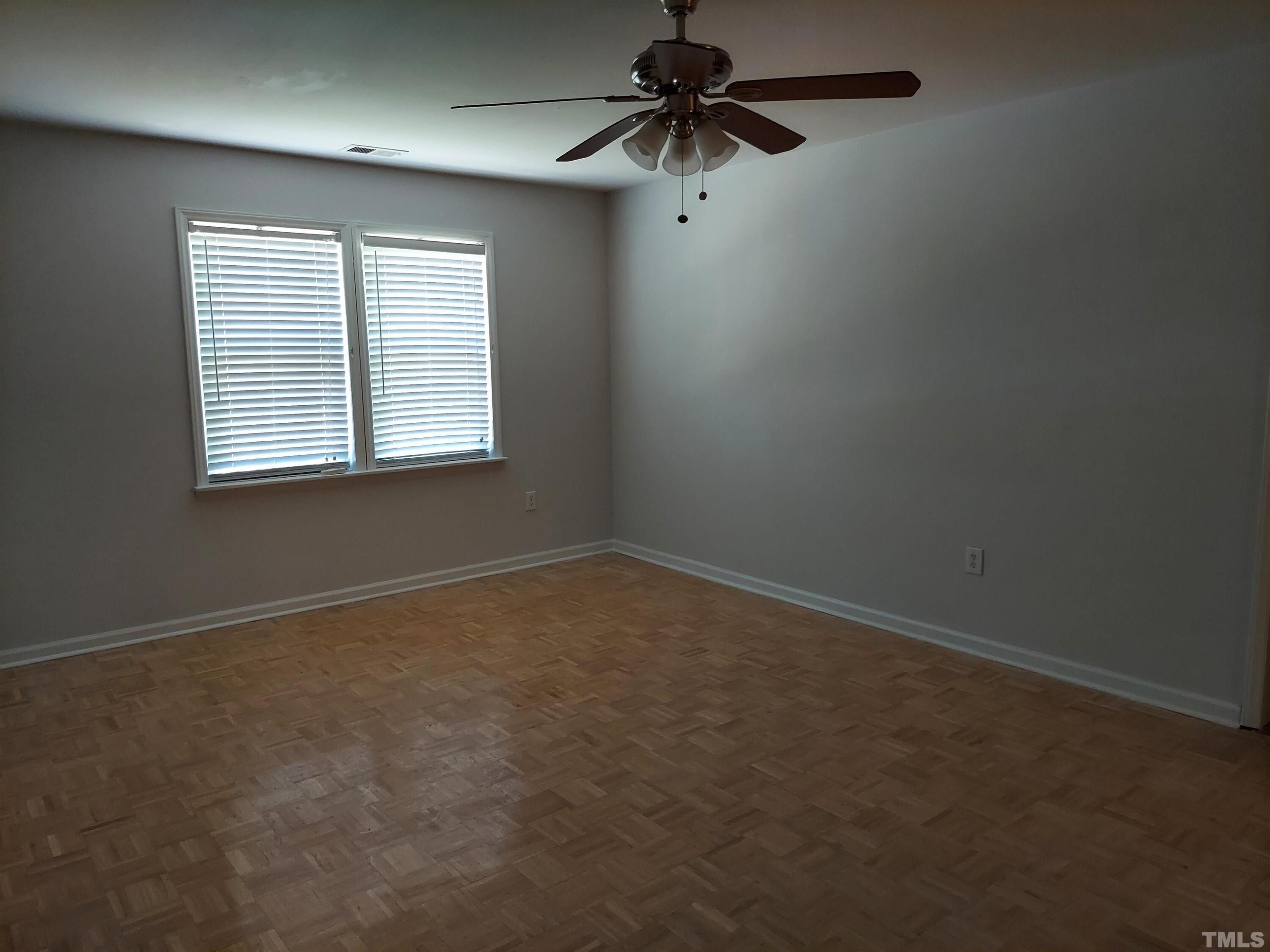 224 Crossfire Road Holly Springs, NC 27540 - Photo 31 of 43 an empty room with a window and a fan