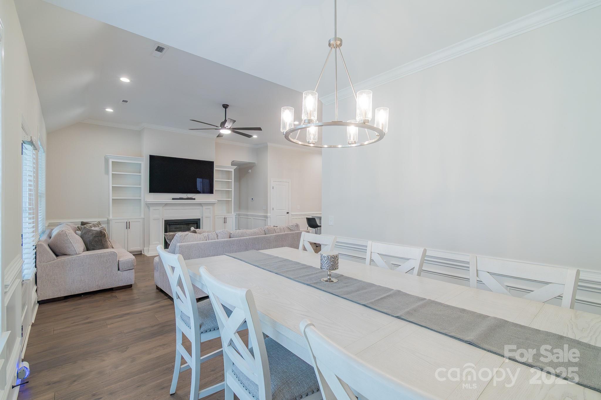 994 Cedar Crest Lane Florence, SC 29501 - Photo 11 of 42 a view of a dining room with furniture and a flat screen tv