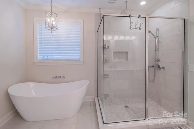 a bathroom with a bathtub and shower