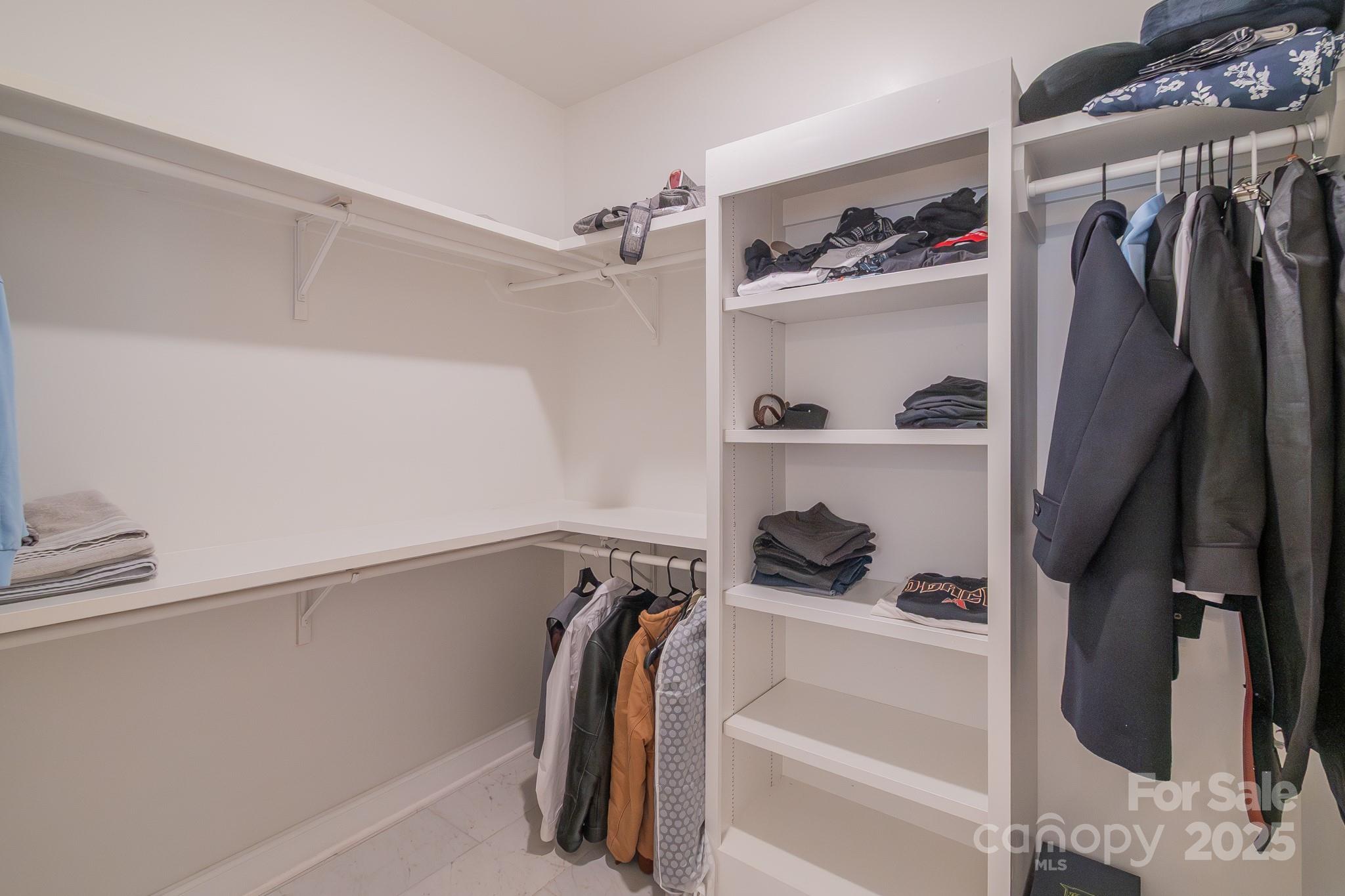 994 Cedar Crest Lane Florence, SC 29501 - Photo 23 of 42 a view of walk in closet with clothes and shoes