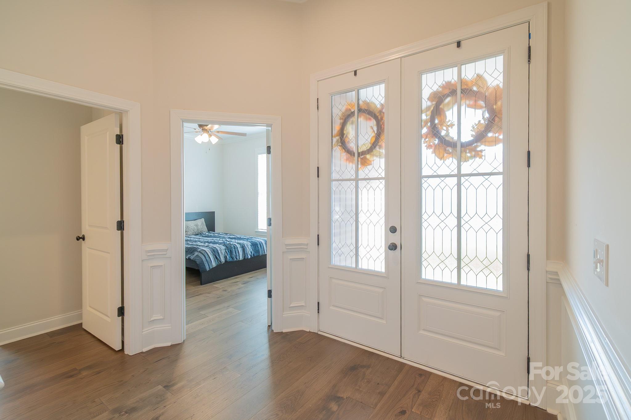 994 Cedar Crest Lane Florence, SC 29501 - Photo 27 of 42 a view of a bedroom with wooden floor and windows