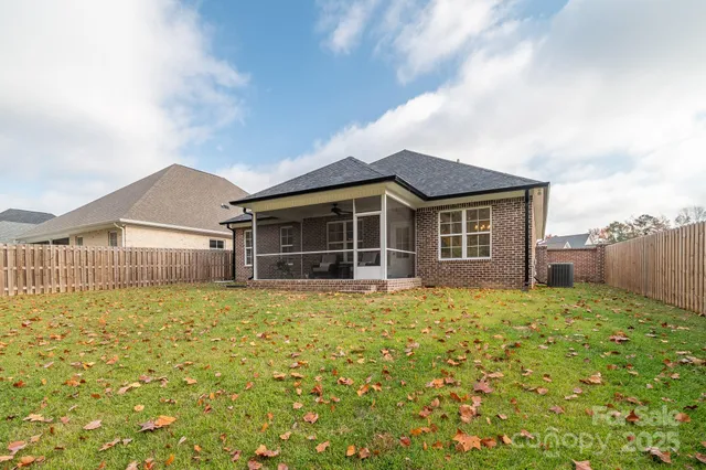 a house view with swimming pool in front of it
