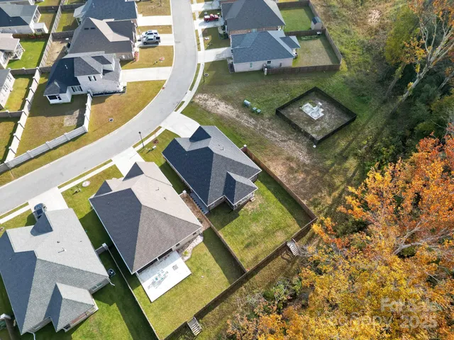 a aerial view of a house with a yard