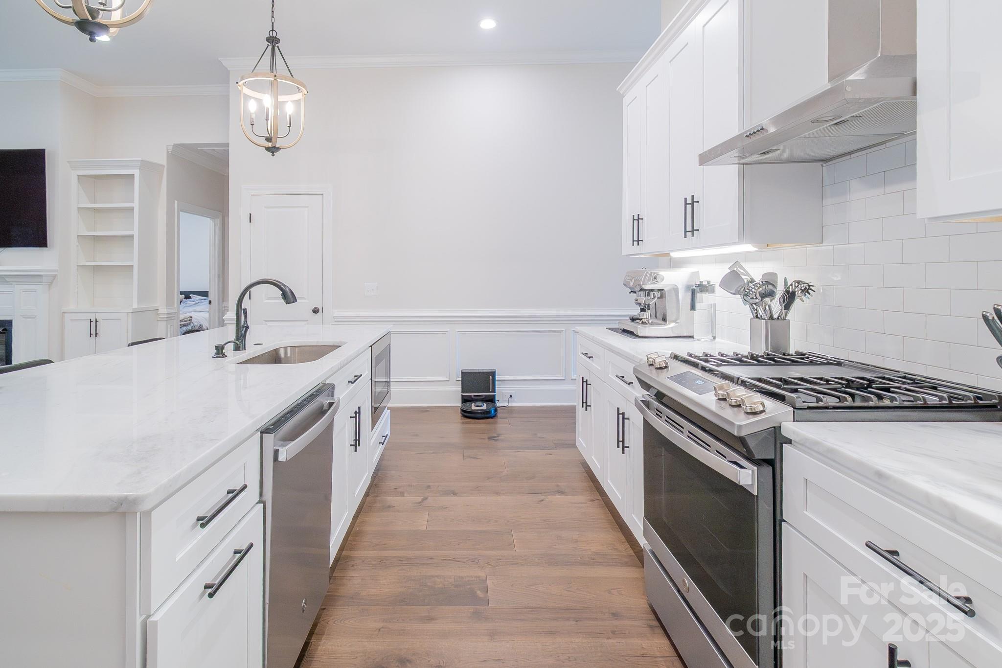 994 Cedar Crest Lane Florence, SC 29501 - Photo 7 of 42 a large kitchen with a stove and a sink