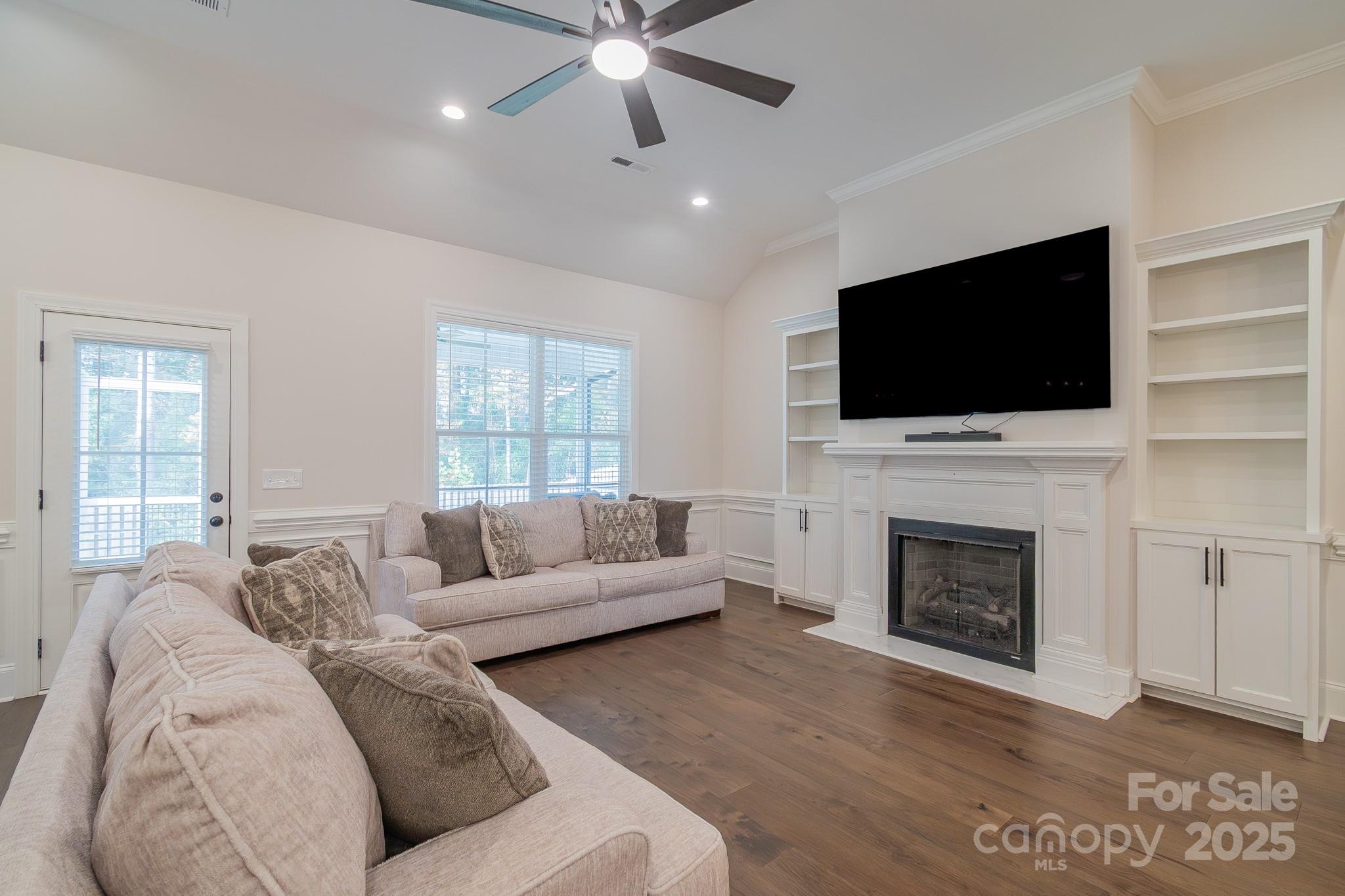 994 Cedar Crest Lane Florence, SC 29501 - Photo 10 of 42 a living room with furniture fireplace and flat screen tv