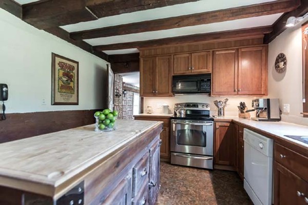 109 Holt Road Andover, MA 01810 - Photo 9 of 30 a kitchen with granite countertop a stove and a sink
