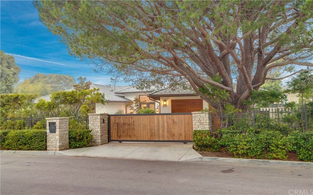 317 Rocky Point Road Palos Verdes Estates, CA 90274 - Photo 1 of 1 front view of a house with a street