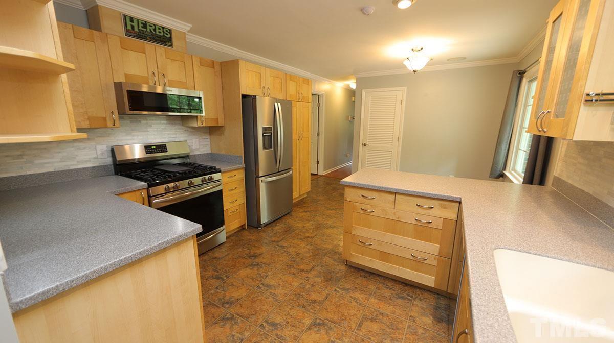3421 Coley Road Durham, NC 27703 - Photo 12 of 30 Another view of the kitchen. Floors are easy to maintain vinyl.