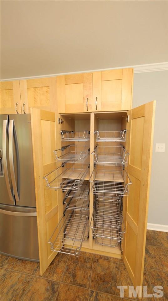 3421 Coley Road Durham, NC 27703 - Photo 13 of 30 The pantry cabinet has pull-out drawers for storage.