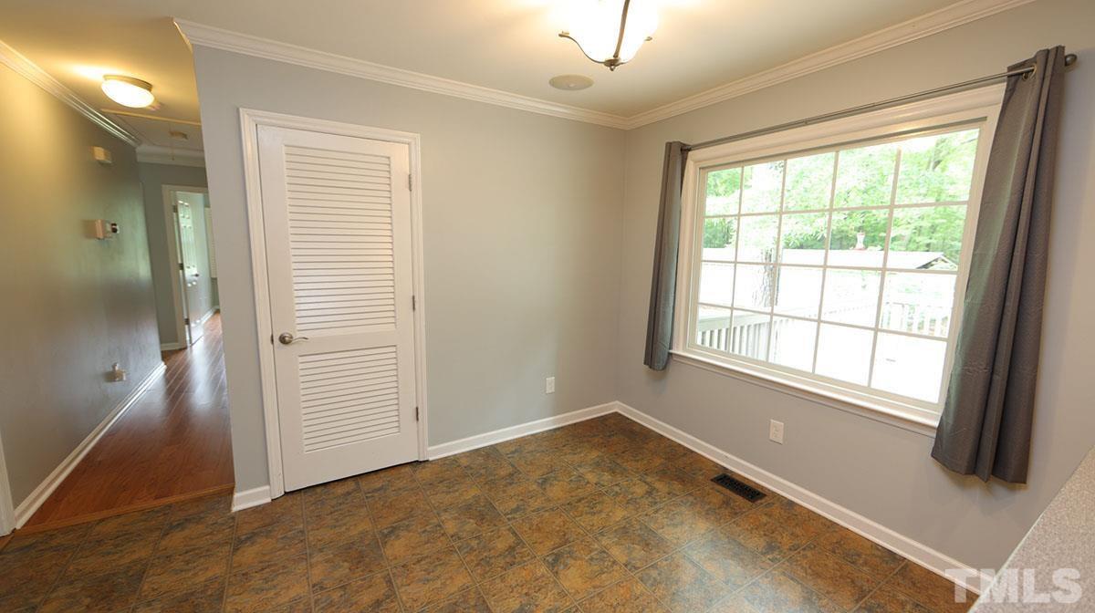 3421 Coley Road Durham, NC 27703 - Photo 14 of 30 The large breakfast area overlooks the deck and the beautiful property.
