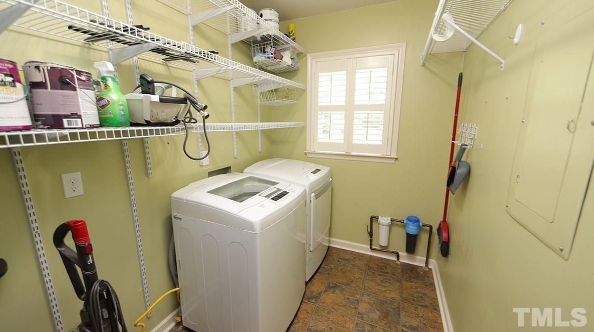 3421 Coley Road Durham, NC 27703 - Photo 15 of 30 Large walk-in laundry room with shelving above. Conveniently located off of the kitchen.