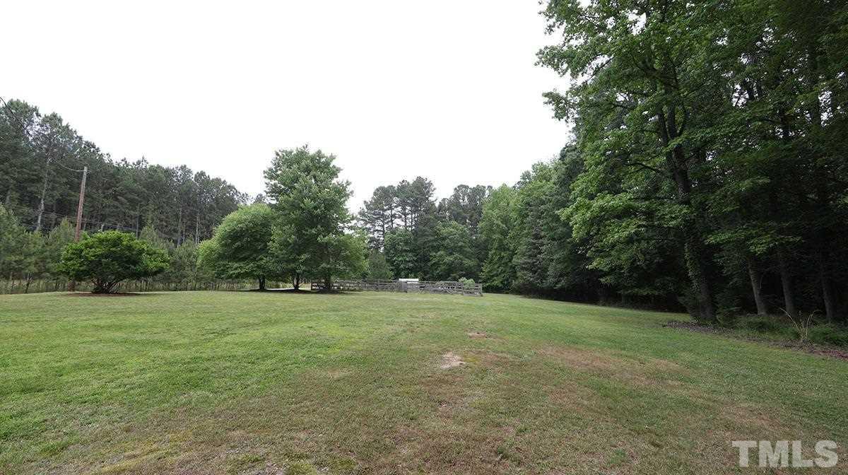 3421 Coley Road Durham, NC 27703 - Photo 23 of 30 The land is fairly level and there is so much room to play, relax, garden. See the gardens beyond.