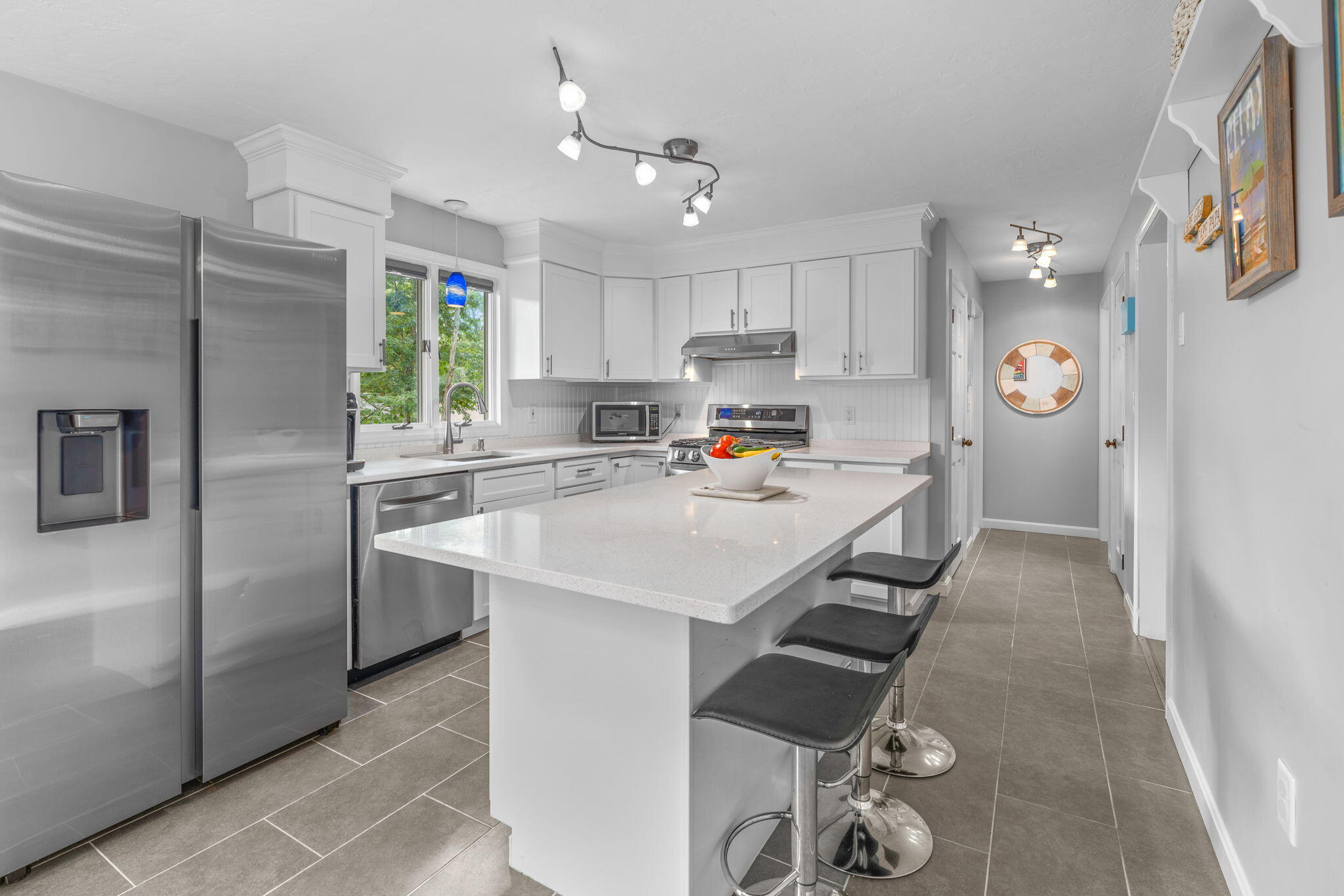 104 Pond Circle Mashpee, MA 02649 - Photo 17 of 29 a kitchen with refrigerator and cabinets