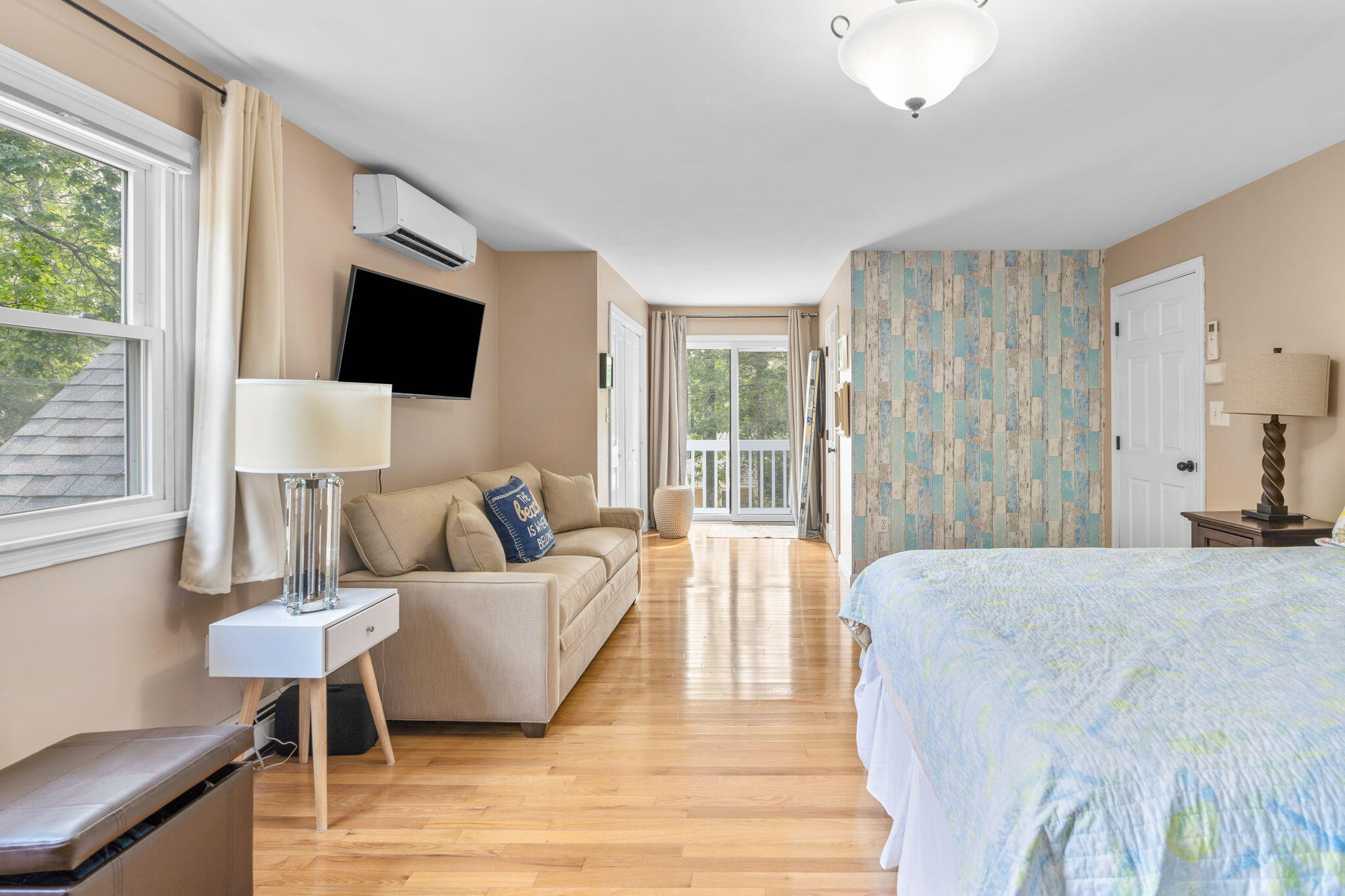 104 Pond Circle Mashpee, MA 02649 - Photo 22 of 29 a living room with furniture and a flat screen tv