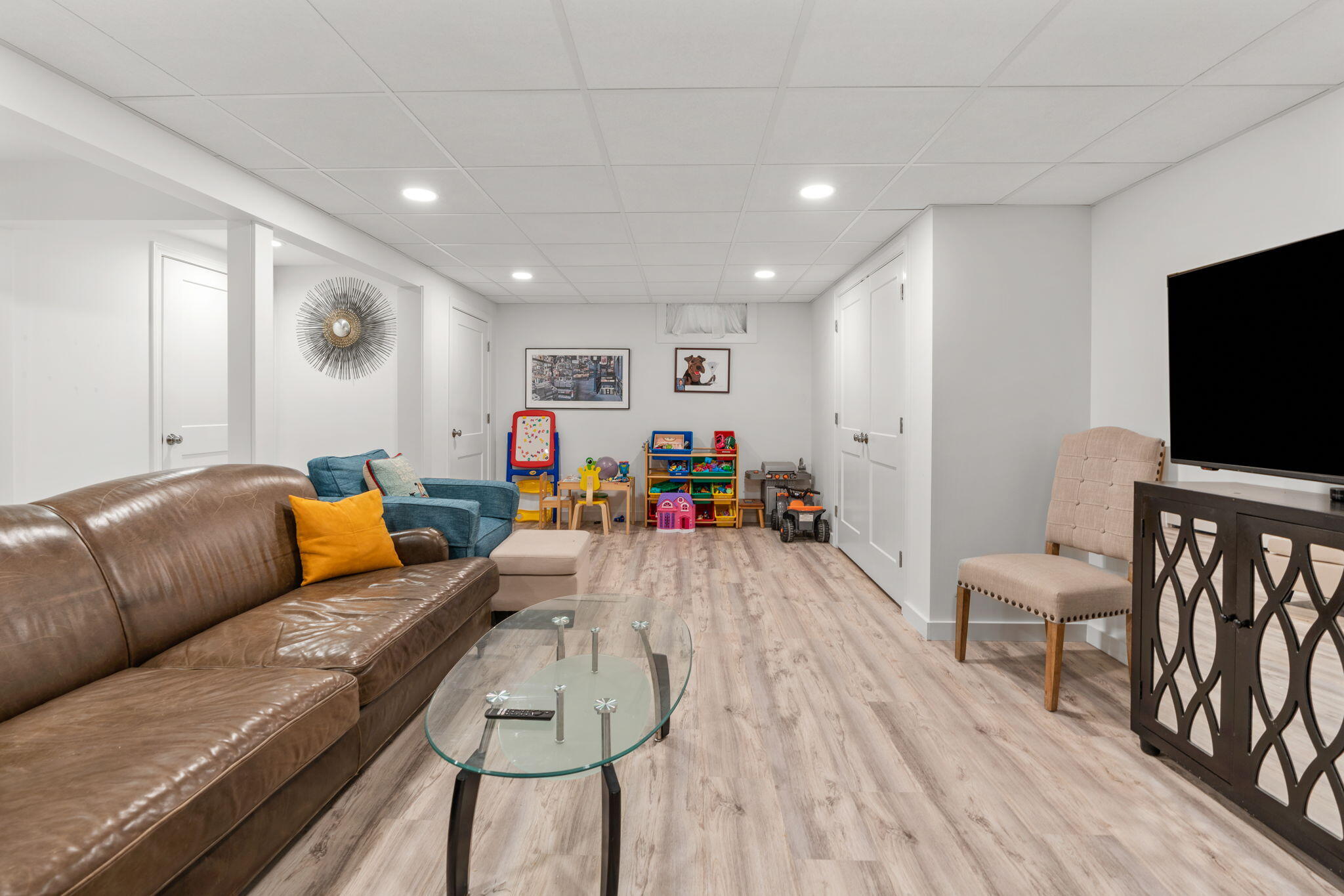 104 Pond Circle Mashpee, MA 02649 - Photo 24 of 29 a living room with furniture and a flat screen tv