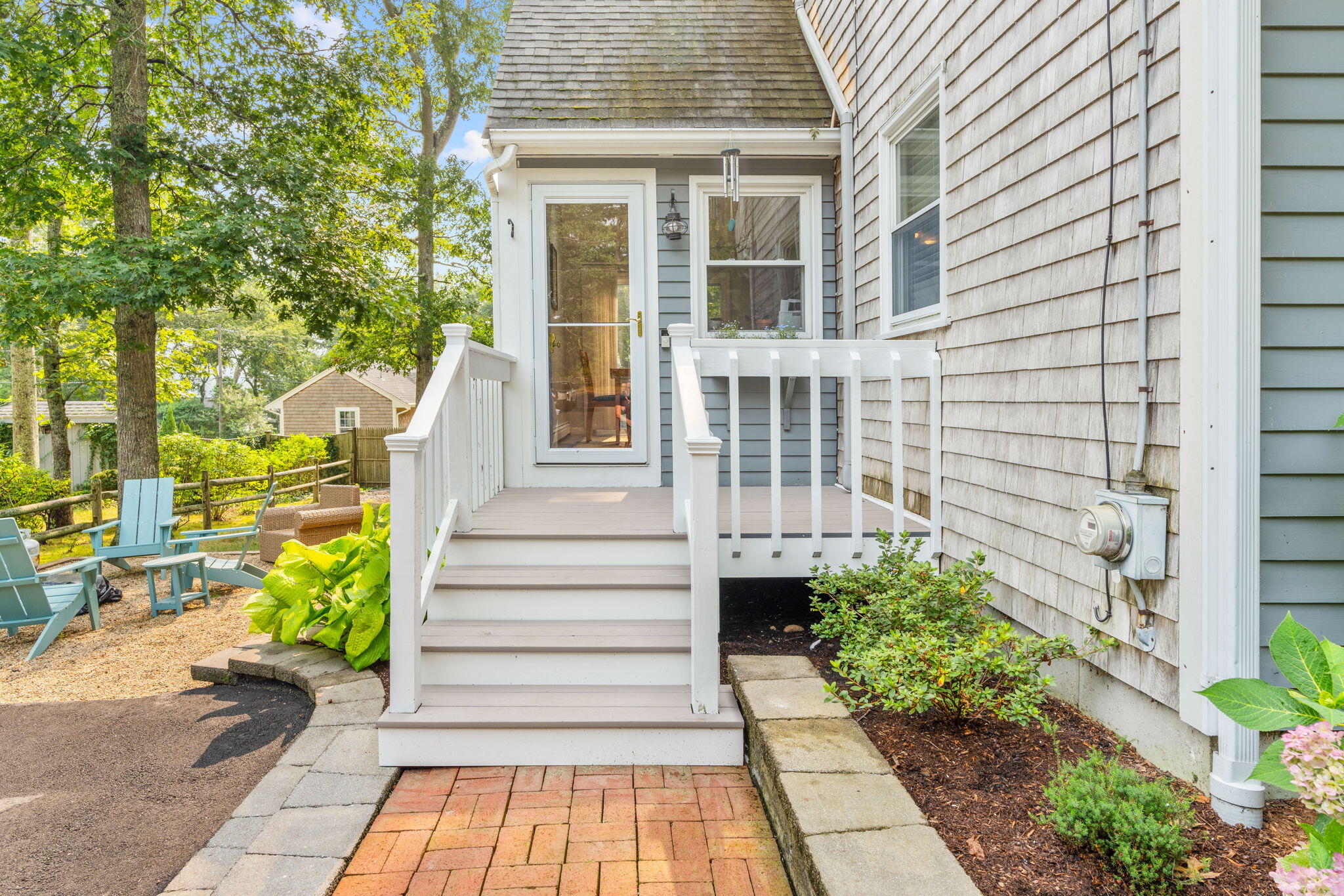 104 Pond Circle Mashpee, MA 02649 - Photo 3 of 29 a view of a house with potted plants