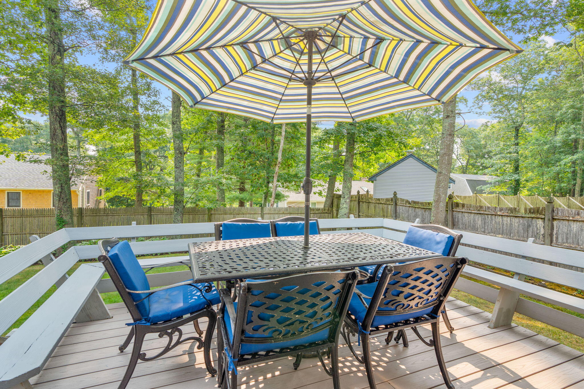 104 Pond Circle Mashpee, MA 02649 - Photo 8 of 29 an outdoor space with furniture and umbrella