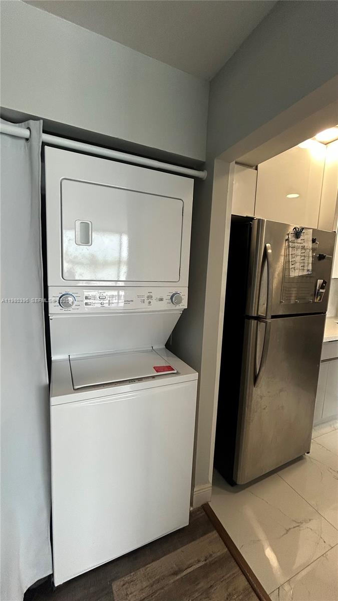 8307 Southwest 142nd Avenue, Unit E112 Miami, FL 33183 - Photo 6 of 12 a utility room with washer and dryer