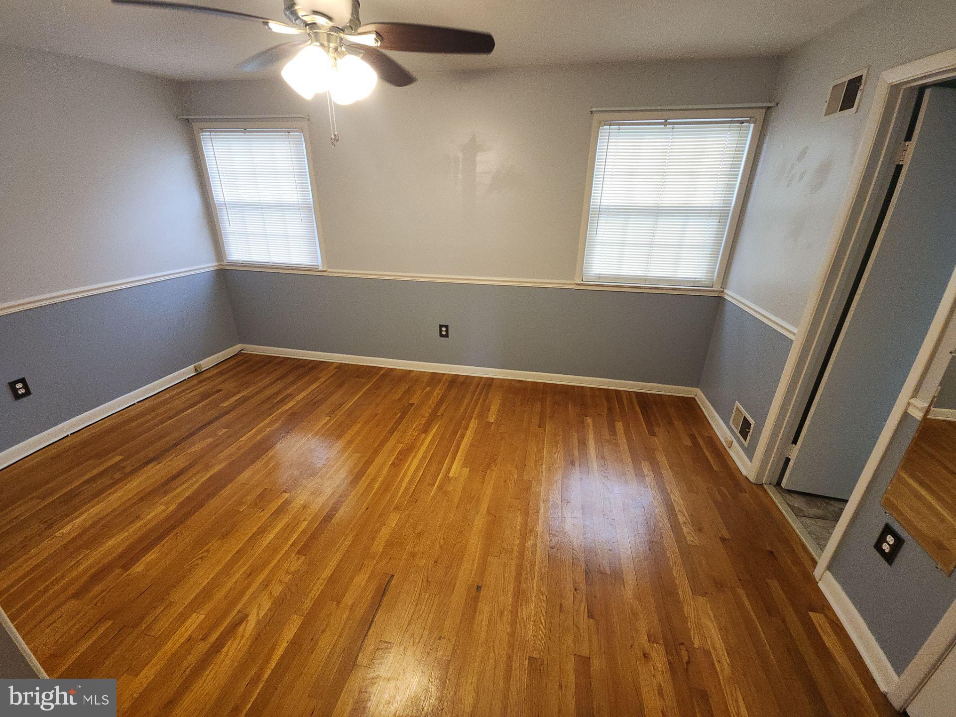 2820 Vixen Lane Silver Spring, MD 20906 - Photo 16 of 20 wooden floor in an empty room with a window