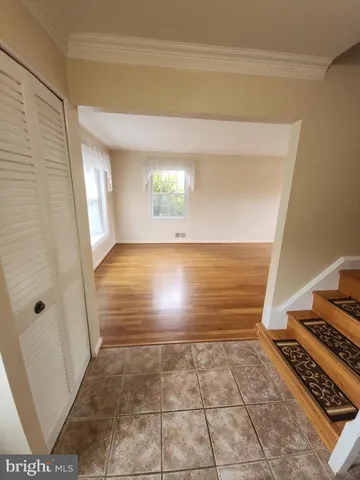 a view of kitchen and an empty room