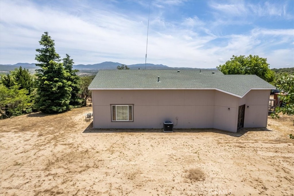 39875 Bautista Road Anza, CA 92539 - Photo 24 of 44 a view of a house with a yard