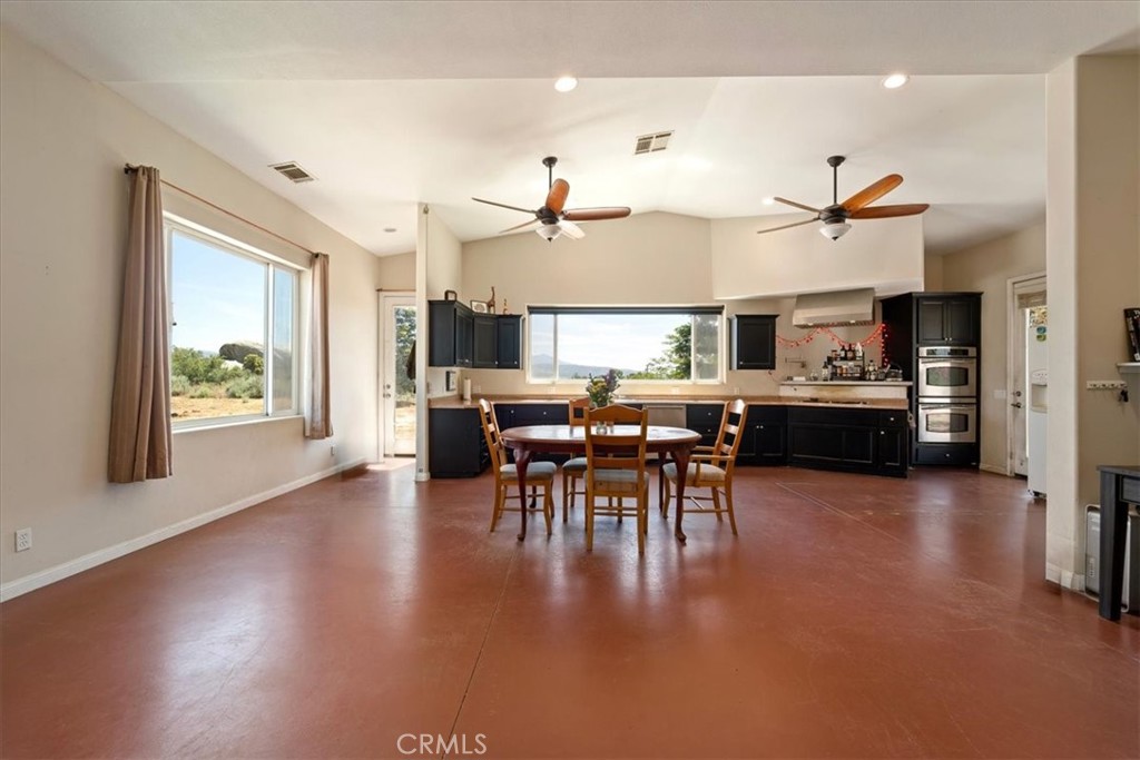 39875 Bautista Road Anza, CA 92539 - Photo 8 of 44 a view of a dining room with furniture window and wooden floor