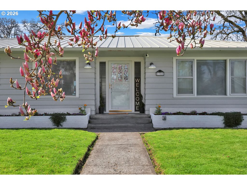 1355 Juniper Street Junction City, OR 97448 - Photo 1 of 45 a front view of a house with garden