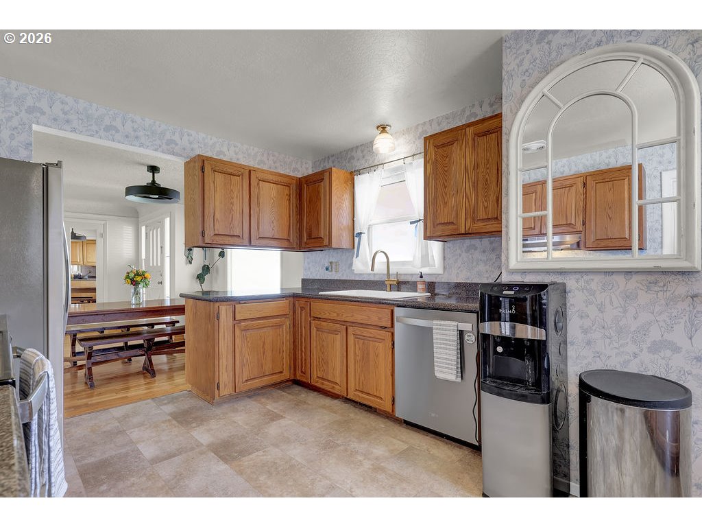 1355 Juniper Street Junction City, OR 97448 - Photo 13 of 45 a kitchen with stainless steel appliances granite countertop a stove a sink dishwasher and a refrigerator