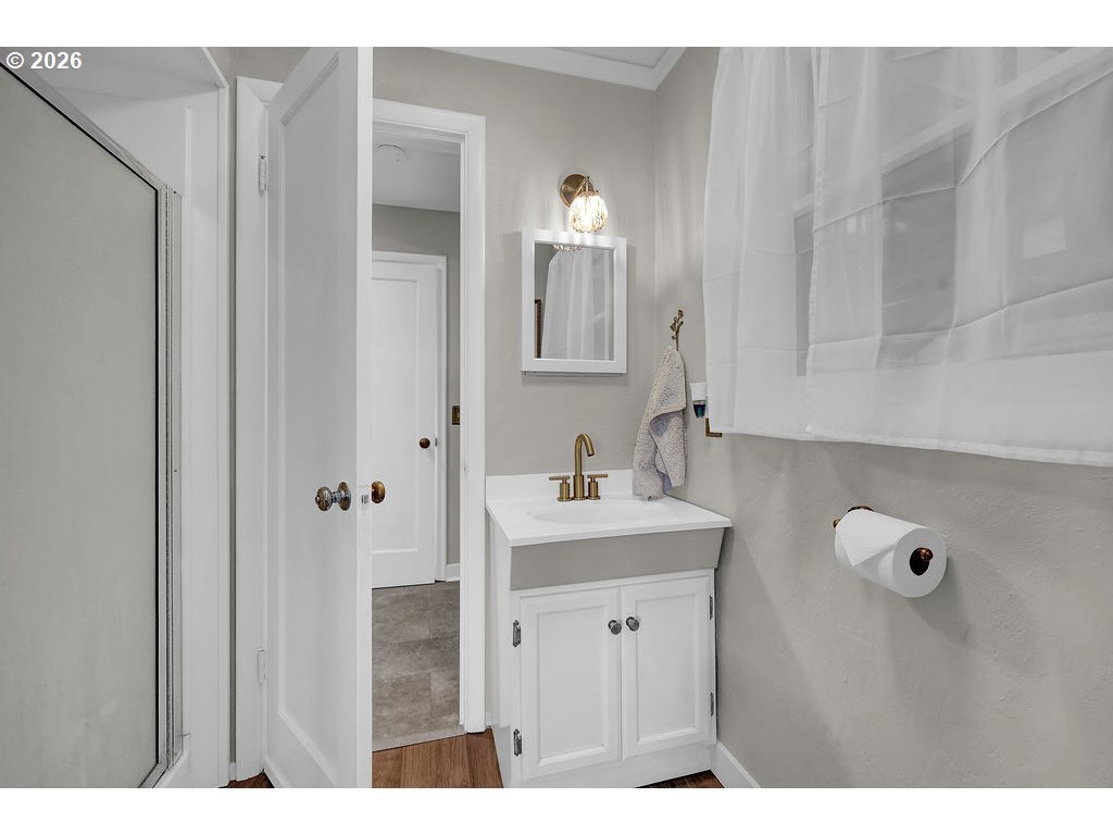 1355 Juniper Street Junction City, OR 97448 - Photo 18 of 45 a bathroom with a sink a mirror and a shower