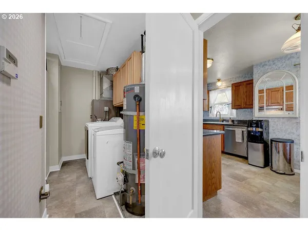 a kitchen with a refrigerator and a sink