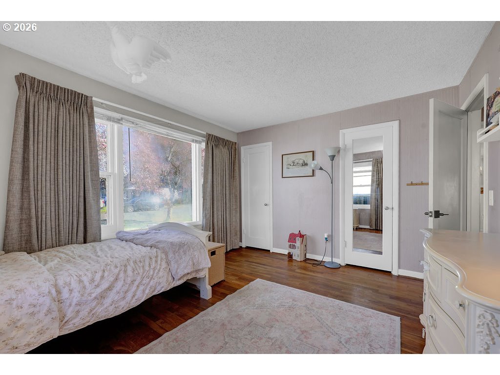 1355 Juniper Street Junction City, OR 97448 - Photo 26 of 45 a bedroom with a bed and a dresser