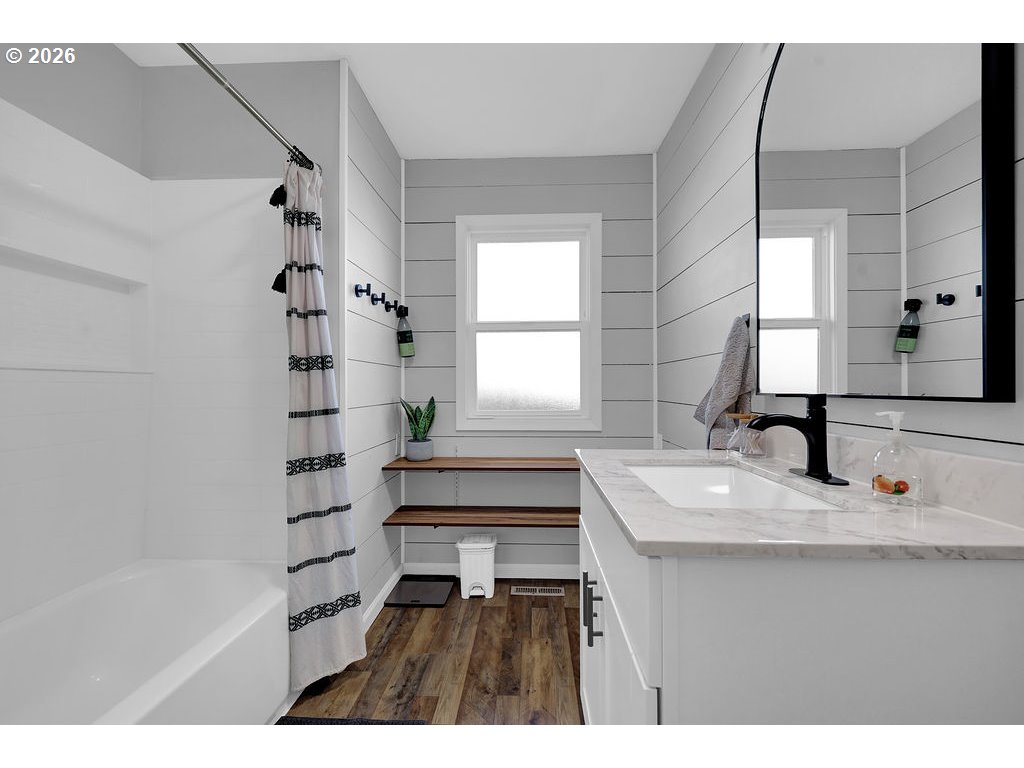 1355 Juniper Street Junction City, OR 97448 - Photo 28 of 45 a bathroom with a sink a mirror and a bathtub