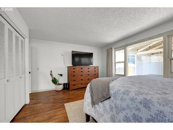 a view of a livingroom with furniture and a flat screen tv