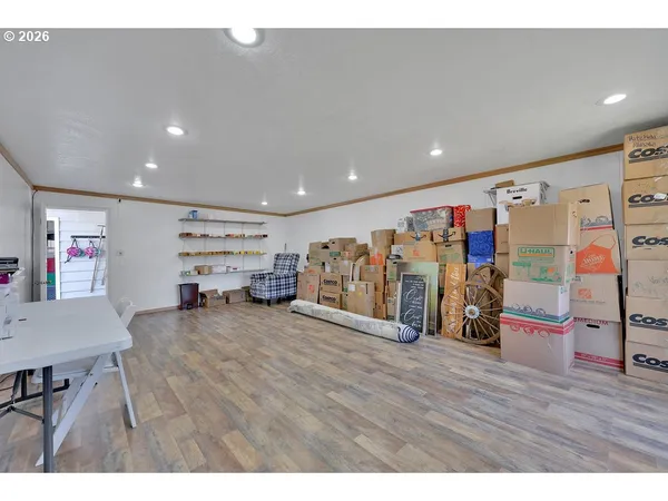 a front view of a house with swimming pool and yard