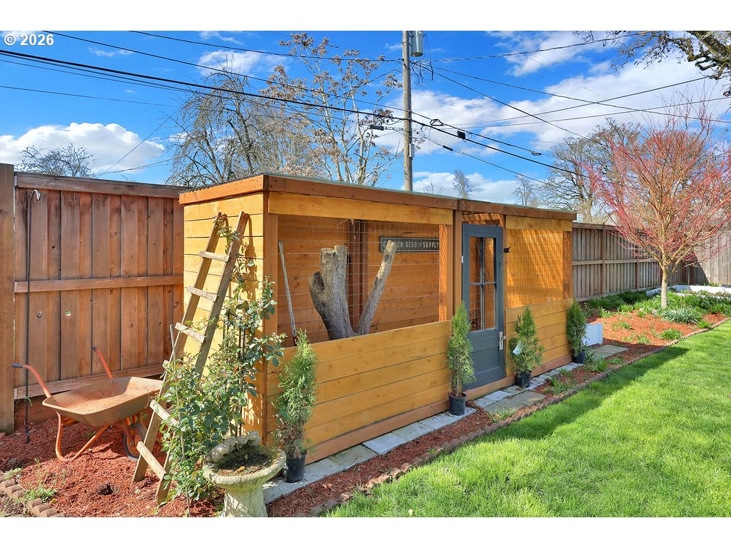 1355 Juniper Street Junction City, OR 97448 - Photo 38 of 45 a view of a backyard with table and chairs and potted plants