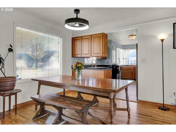 a view of a dining room with furniture and window