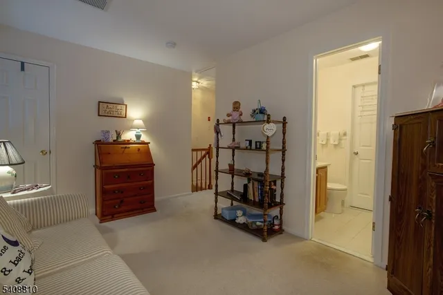 a view of a bedroom with workspace